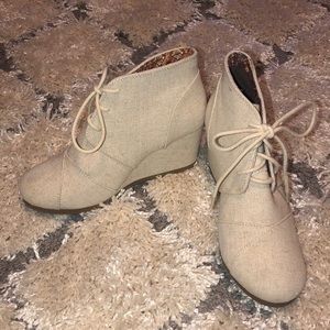 Cream colored wedge booties